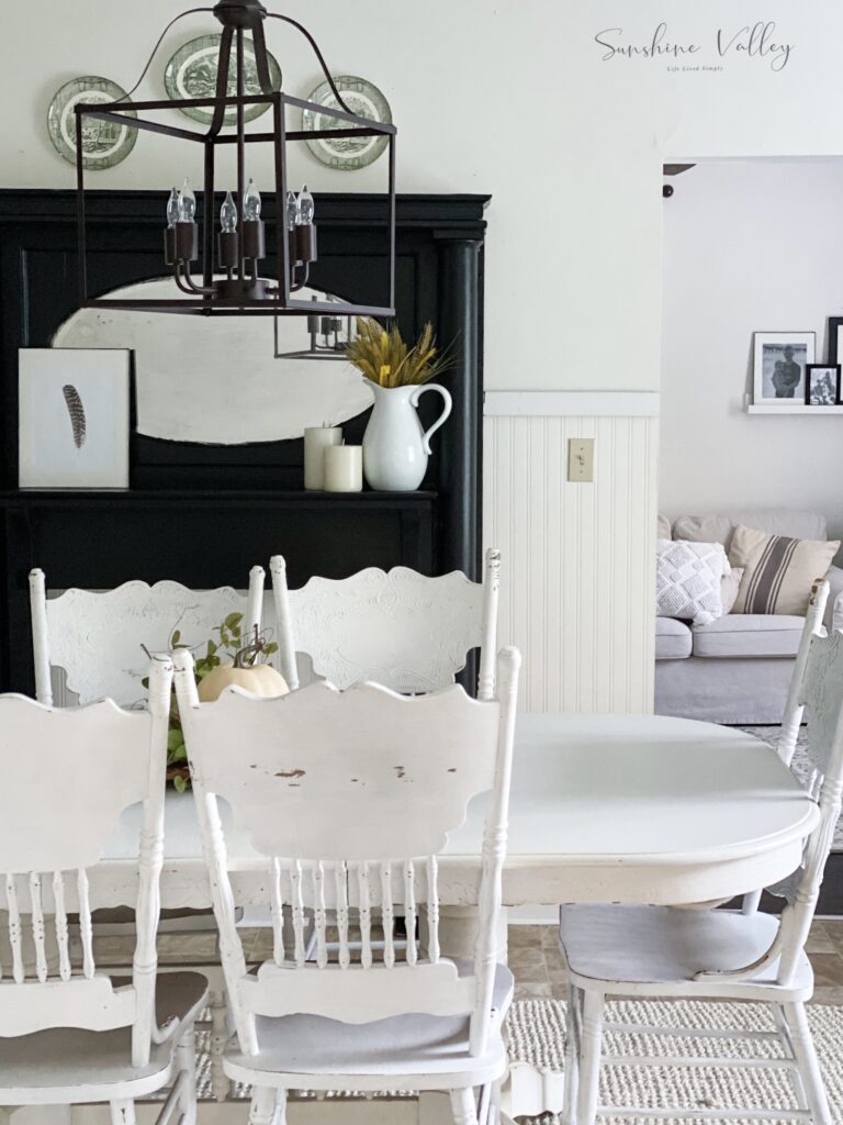Victorian farmhouse dining room with black painted mantle