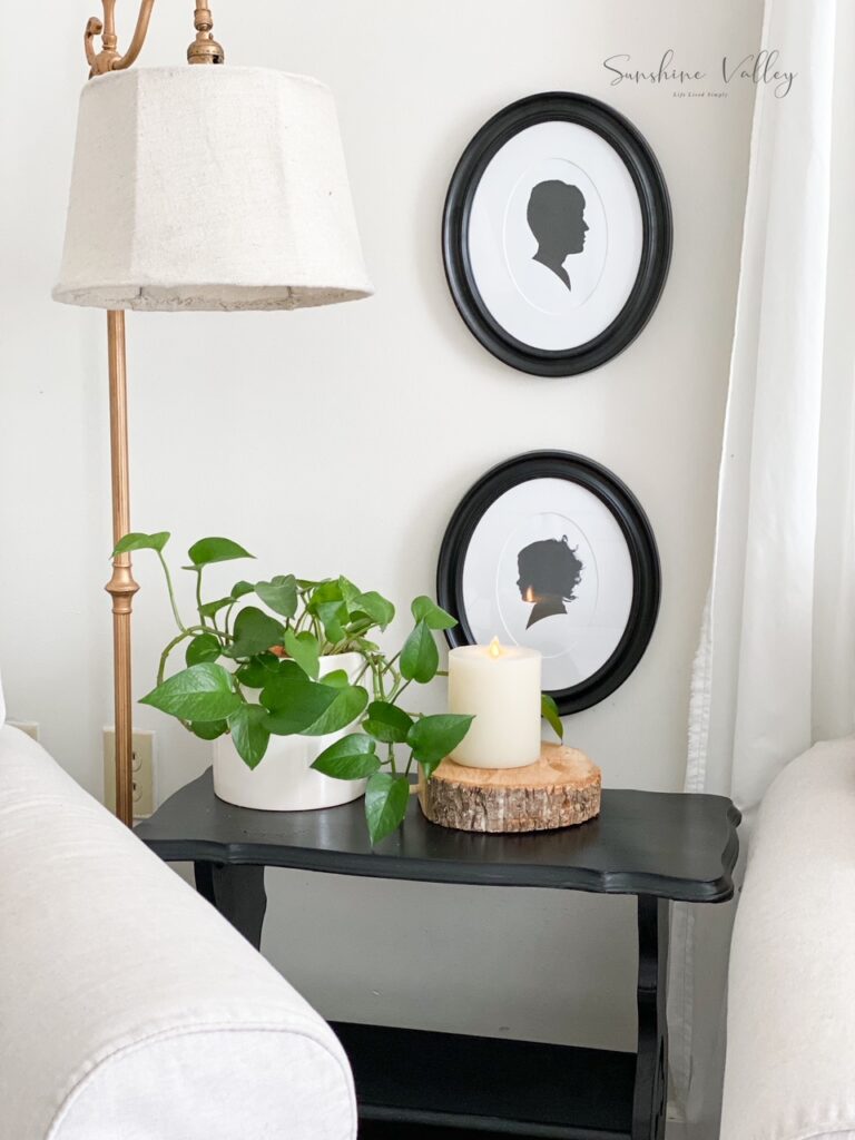 side table painted black with silhouettes  of children